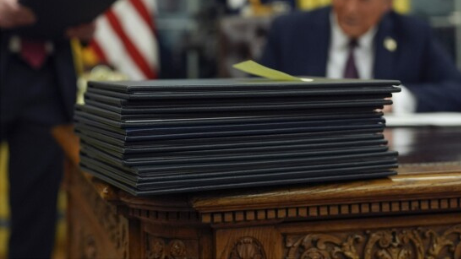 A large stack of legislation on a U.S. Presidential deck