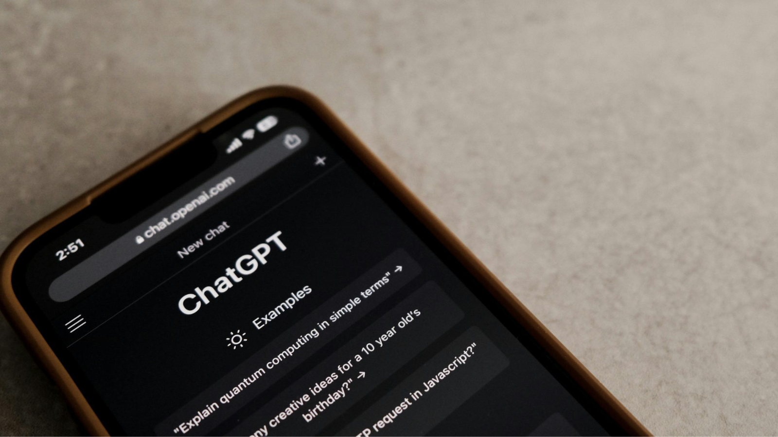 Mobile phone with ChatGPT homepage on screen. 